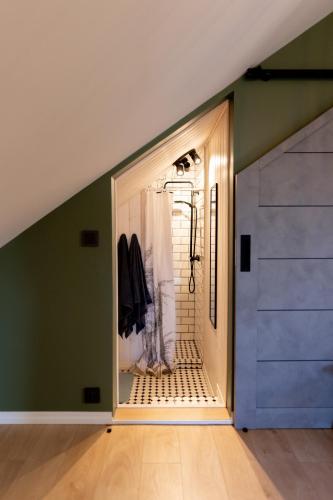 a door leading into a room with a closet at Lendle Peace & Wellness Stay Märjamaa in Märjamaa