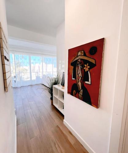 a painting on a wall in a room at Beach Veranda Hotel Punta Cana in Punta Cana