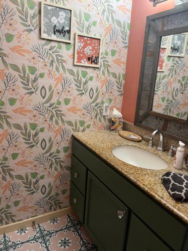 a bathroom with a sink and a mirror at Sky Valley Casa Dolce Vita in Sky Valley
