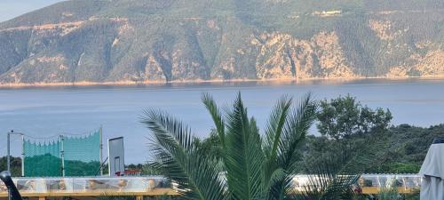 a view of a body of water with a mountain at Luxury White Sails Villas with a Multi Sport Court and Sea View in Pinezici