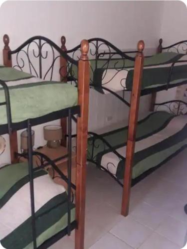 a pair of bunk beds in a room at Hostel WAIVING MILL in Oranjestad