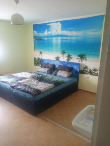 a bedroom with a bed with a painting on the wall at Bauernwohnung in Waldmünchen