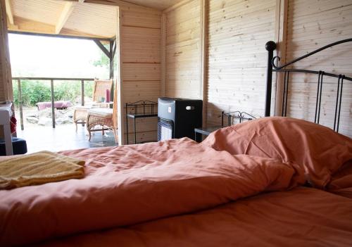 a bedroom with a large bed in a room at Cottage in Remízek in Havlíčkŭv Brod