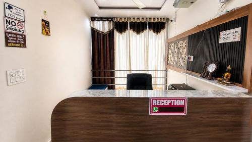 a room with a reception desk with a sign on it at HotelTree in Hisār