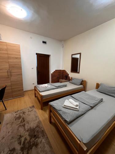 a room with three beds in a room at Musical Pansion Radgost, Rtanj in Rtanj