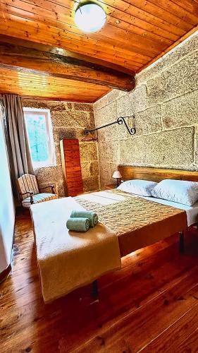 a bedroom with a large bed in a room at Border Bridge House in Tui