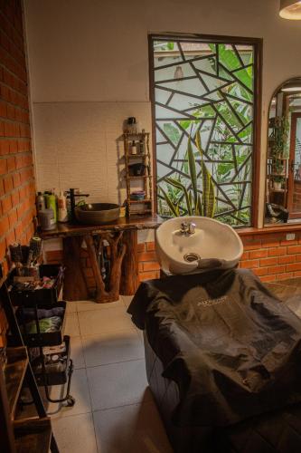a bathroom with a sink and a stained glass window at Villa Lu Amazon Ecolodge in Tarapoto