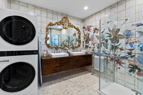 a bathroom with a sink and a mirror at Stonehurst Estate Sleep 16 in Chilliwack