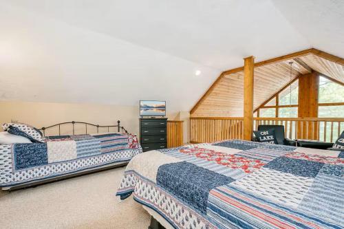a bedroom with two beds and a window at Lake Bear Lair in McHenry