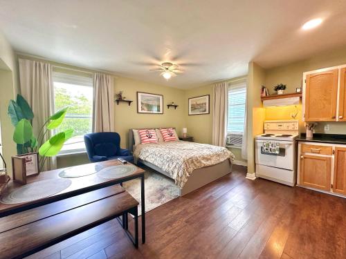 a small bedroom with a bed and a kitchen at Summer Sale 1BR Big Kitchen by River and Trails in Bridgewater