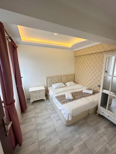 a hotel room with two beds and a window at Air Otel in Trabzon