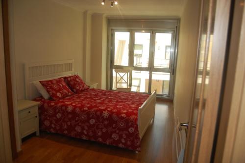 Posteľ alebo postele v izbe v ubytovaní Apartamentos Cedeira