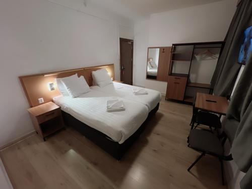 a hotel room with a bed and a mirror at Hotel 2000 Valkenburg in Valkenburg