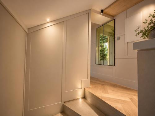a staircase in a house with a mirror at Book-A-Room Salzburg Garden or Balcony Stay - 2 bedroom - air conditioning & free parking in Salzburg