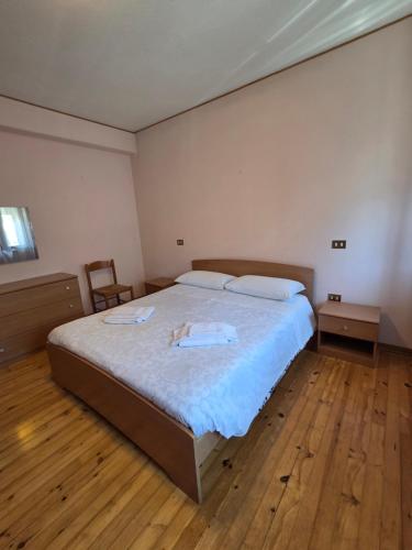 a bedroom with a bed with two towels on it at Piccola Stella in Moggio Udinese