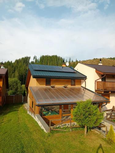 a house with a solar panel on the side of it at Bungalov Jozef in Liptovská Teplička
