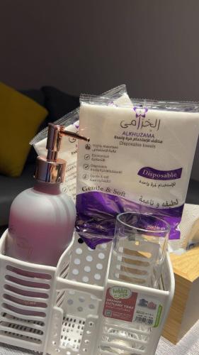 a bottle of soap and a box on a table at شالية ريفي الفندقي هادي وسط المدينة in Az Zulfi