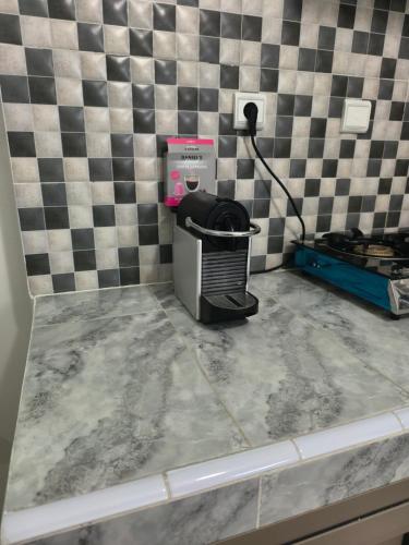 a hair dryer sitting on top of a counter at Studio avec terrasse privée sans vis-à-vis in Essaouira