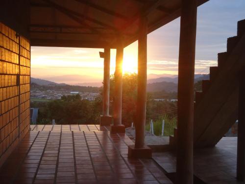 a sunset seen from the porch of a building at San Agustín Wayrana in San Agustín