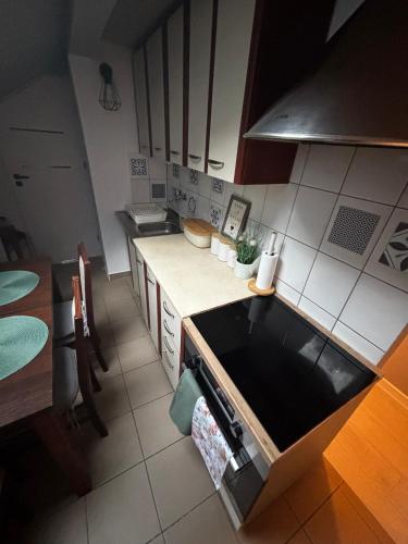 an overhead view of a kitchen with a stove top oven at Apartamenty Trzcińsko 47 in Janowice Wielkie