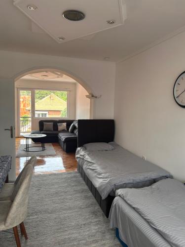 a living room with two beds and a couch at Mila apartments in Prilep