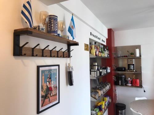 a kitchen with a picture on the wall at Corrientes Center in Buenos Aires