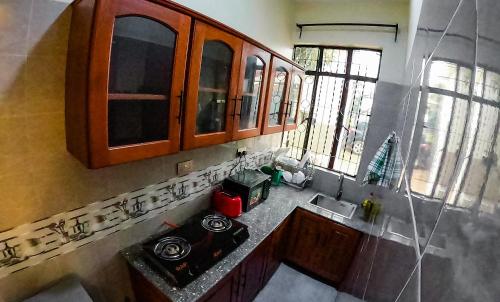 an overhead view of a kitchen with a stove and windows at Makali Private Villa- 2En-Suite Bedrooms in Arusha
