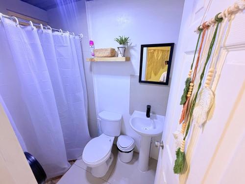 a bathroom with a toilet and a sink at Taltal - Casa Dominguez in Taltal