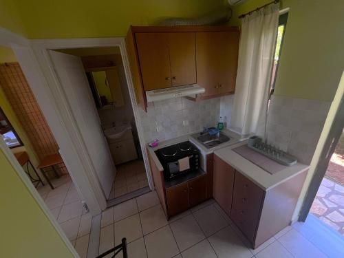 an overhead view of a small kitchen with a sink at Ionian Bay Studios in Lefkada