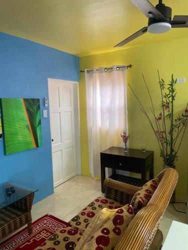 a living room with a couch and a table at Attres in Monkey Hill