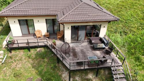an overhead view of a house with a deck at Forest House Doftana in Teşila