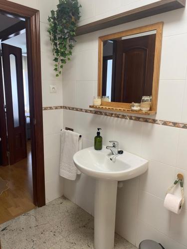 a bathroom with a sink and a mirror at El Pasaje del Marqués in El Burgo de Osma