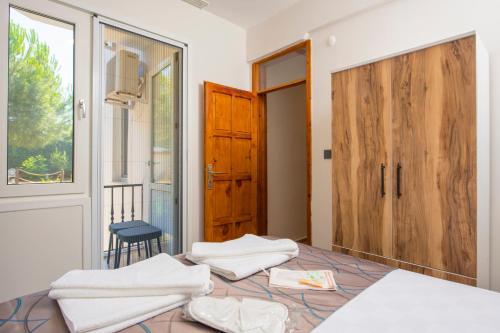 a bedroom with two white towels on a bed at Marvera Hotel in Fethiye