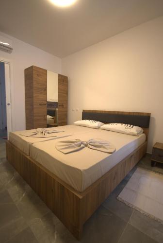 a bedroom with a large bed in a room at Villa Lumi Mat in (( Mal i Kakariqit ))