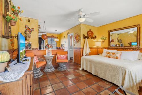 a bedroom with a bed and a tv in a room at Blue Seas Courtyard in Fort Lauderdale