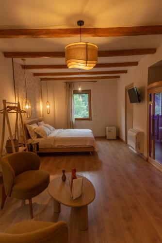 a large bedroom with a bed and a table at Chiarelli Mountain Suite in Camigliatello Silano
