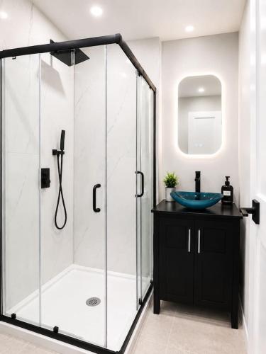a bathroom with a glass shower and a sink at Journal Sq PATH - Private Queen Room - Private Bath - Shared Kitchen - 15 Min to NYC in Jersey City