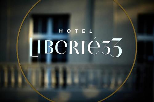 a mirror with the words hotel ligne in it at Liberté 33, an Ascend Collection Hotel in Poznań