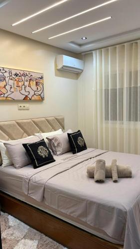 a large white bed with two pillows on it at Dar marhaba in Tangier