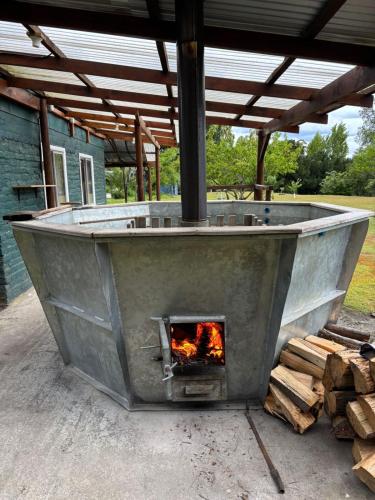 a large outdoor oven with a fire in it at Campo Yumbel in Yumbel