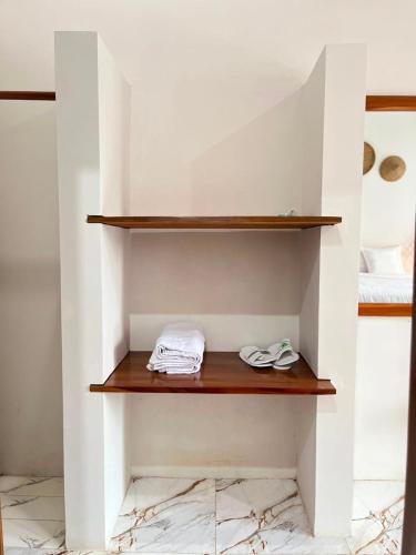 a shelf in the corner of a room at Villa Bumi Detani in Selabintana