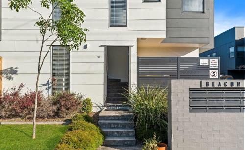 a house with a staircase leading to the front entrance at Gemstone in Morayfield
