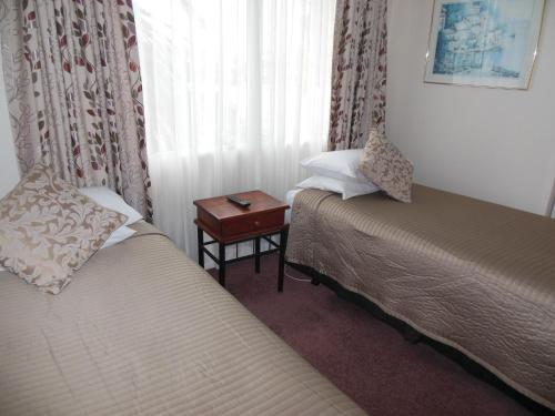 Легло или легла в стая в ASURE Camelot Arms Motor Lodge