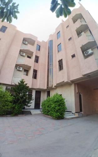 a large building with a lot of windows at Grace Land Hotel - Awash in Āwash