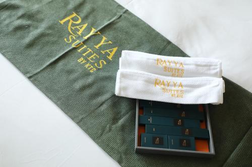 a pile of towels on top of a table at Rayya Suites , Invercargill in Invercargill