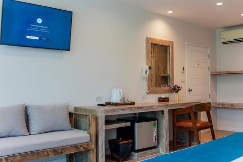 a living room with a table and a couch at LOVE beach club Koh Samui in Chaweng