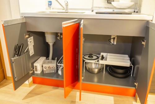 a kitchen with a sink and a counter top at WHITE HOTEL GRAND HAKUBA in Omachi