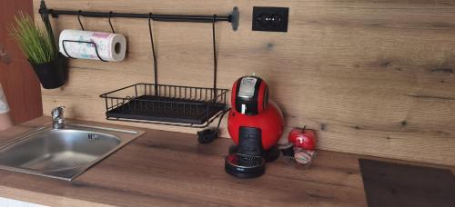 a kitchen counter with a vacuum next to a sink at F 207 Primorsko del Sol - просторно студио с кухня in Primorsko