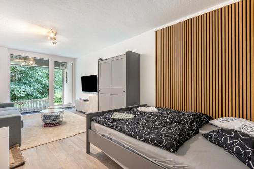 a bedroom with a bed and a television in it at Apartment Maja in Winterberg