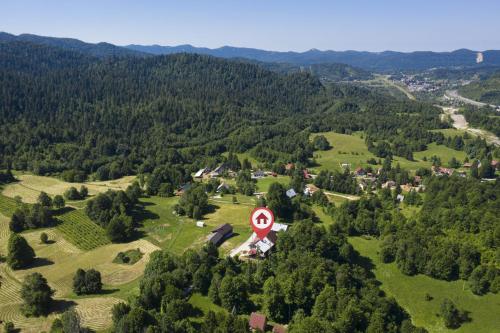 an aerial view of a village with a speed sign at Mountain Escape house with indoor pool in Fužine